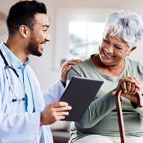 doctor speaking with mature female patient